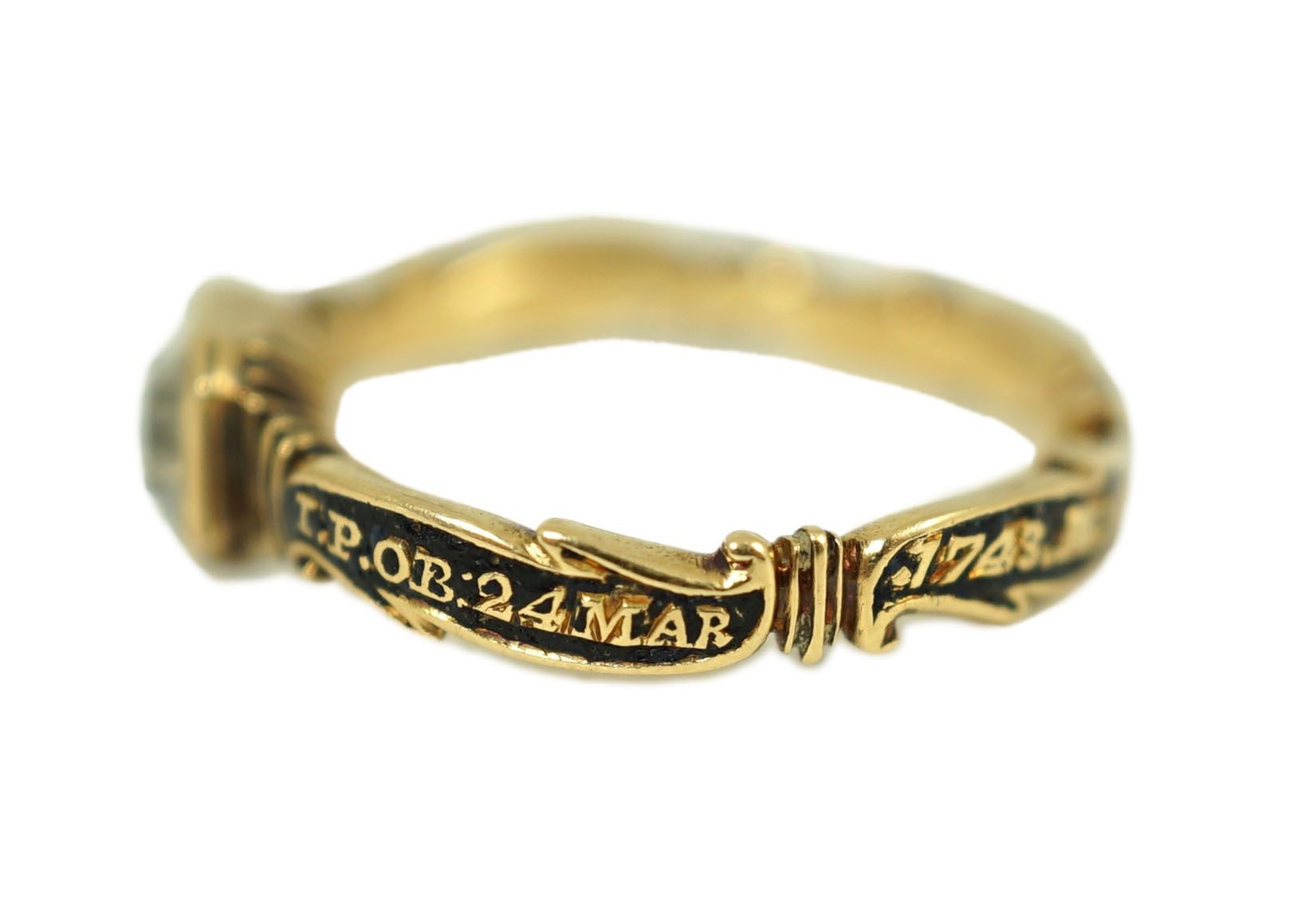 A George II gold, black enamel and rock crystal set mourning ring